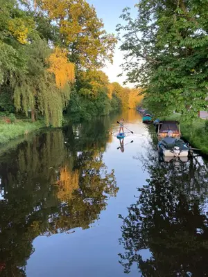 a couple of people in a boat on a river at Deborah's Hiding Place in Alkmaar