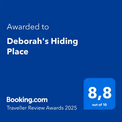 a screenshot of a phone with the text awarded to deborahs hiding place at Deborah's Hiding Place in Alkmaar