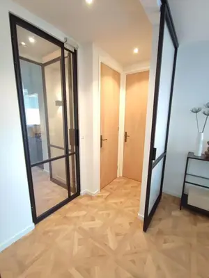 a hallway with a door and a mirror at Luxury room with private bathroom on great location. in Amsterdam