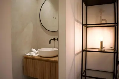 a bathroom with a sink and a mirror at Luxury room with private bathroom on great location. in Amsterdam
