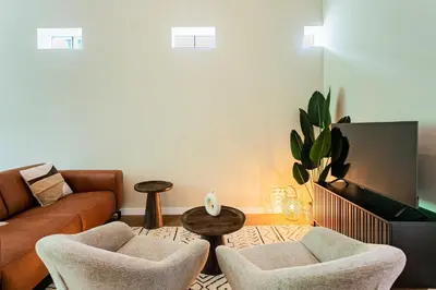 a living room with a couch and two chairs and a table at Stylish apartment next to the Amstel River - Unit A in Amsterdam