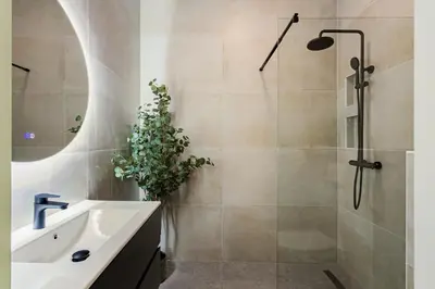 a bathroom with a sink and a shower at Stylish apartment next to the Amstel River - Unit A in Amsterdam