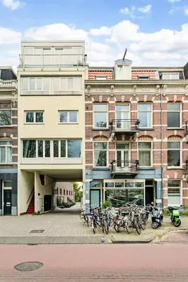 a building with bikes parked in front of it at Stylish apartment next to the Amstel River - Unit C in Amsterdam
