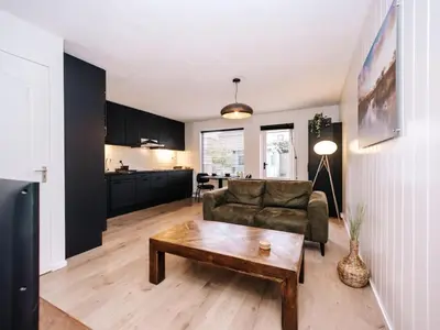 a living room with a couch and a coffee table at Malu in Zandvoort