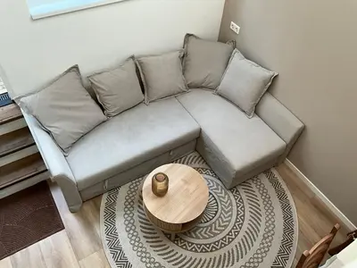 a living room with a couch and a table at Nieuwe vakantie woning nabij het strand - Egmond at the Beach House in Egmond aan Zee