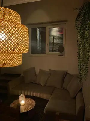 a living room with a couch and a window at Nieuwe vakantie woning nabij het strand - Egmond at the Beach House in Egmond aan Zee