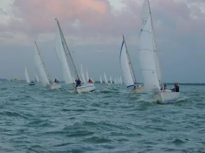 a group of sailboats are in the water at Marina VILLA nabij water met prive sauna. in Spakenburg