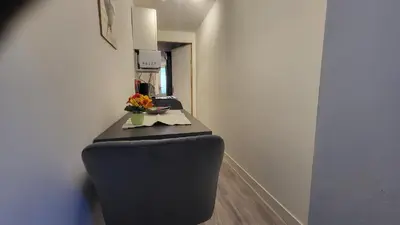 a corridor with two toilets in a room at BnB Souterrain in Amsterdam