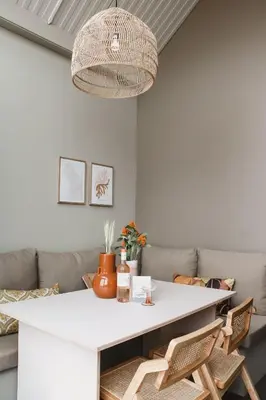 a living room with a white table and chairs at Strandhuisjes Zoomers aan Zee in Castricum
