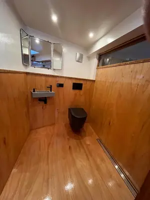 a bathroom with a toilet and a sink at Casey's Lake View House Boat in Amsterdam