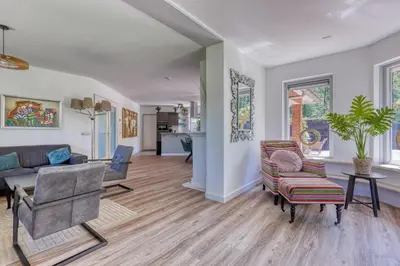 a living room with a couch and chairs at Forest Villa with shared pool & Eco Wellness in Zeewolde