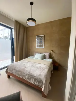 a bedroom with a bed and a large window at Gorgeous room near Haarlem Station, city center in Haarlem