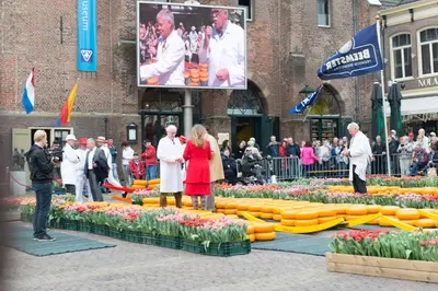 a group of people standing in front of a display of flowers at Villa View in Alkmaar