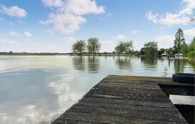 a view of a large body of water with a dock at Stunning Stacaravan In Reeuwijk in Reeuwijk