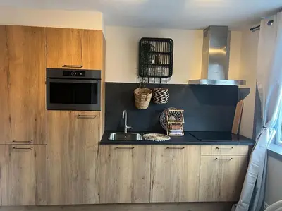 a kitchen with a sink and a microwave at Mint aan het strand in Egmond aan Zee
