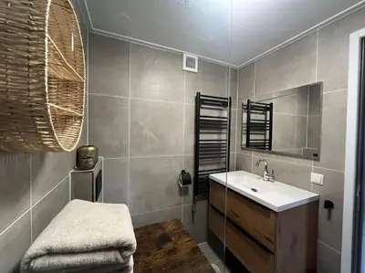 a bathroom with a sink and a mirror at Mint aan het strand in Egmond aan Zee