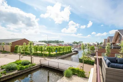 arial view of a river with buildings at Meerzicht 57 - 3 bedroom appt with sunny terrace in Uitgeest