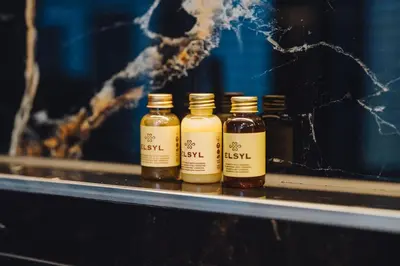 four bottles of honey sitting on a shelf at Løk Historics luxury art-inspired loft in historic city centre! in Haarlem