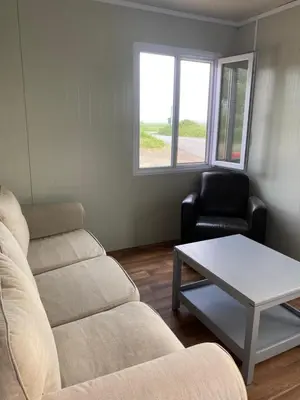 a living room with a couch and a coffee table at Nieuwendijk hoeve in Oud-Ade