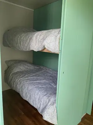 two bunk beds in a room with a bed at Nieuwendijk hoeve in Oud-Ade