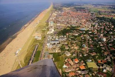 a view of a beach and a city from an airplane at Enjoyable holiday home in Noordwijk