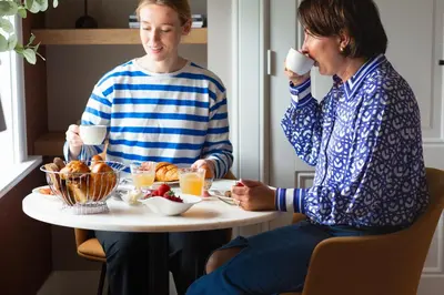 two women sitting at a table drinking coffee at Boutique Pastorale in Linschoten