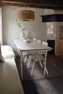 a white table and chairs in a room at Huis met de Kogel in Alkmaar