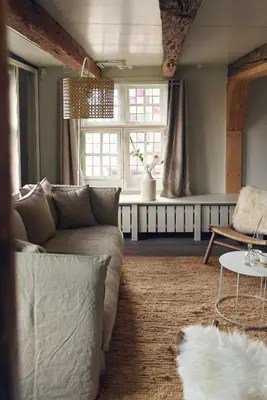 a living room with a couch and a table at Huis met de Kogel in Alkmaar