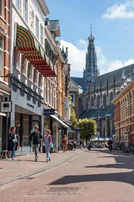 a city street with people walking down the street at Tranquil Guest House in Zandvoort