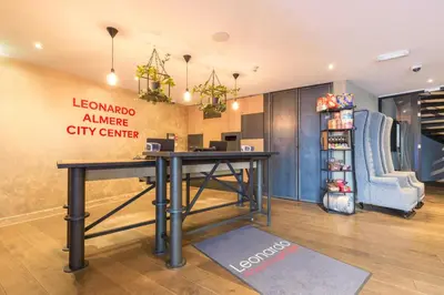 an office with a desk and a city center at Leonardo Hotel Almere City Center in Almere