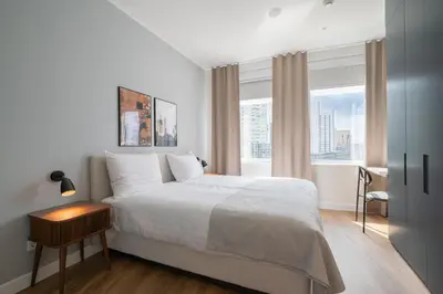 a bedroom with a white bed and a window at Limehome Amsterdam Gatwickstraat in Amsterdam