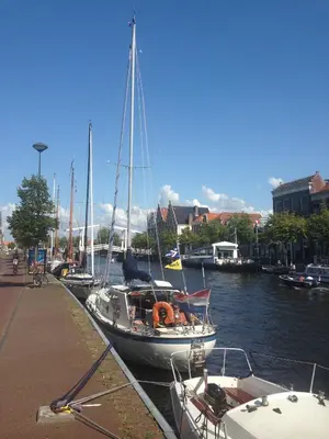 a group of boats docked in a harbor at Turfhuys aan het Spaarne in Haarlem