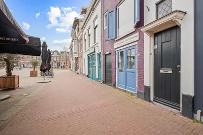 an empty street in a city with buildings at Turfhuys aan het Spaarne in Haarlem