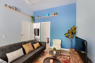 a living room with a couch and a table at Stylish apartment next to the Amstel river- Unit D in Amsterdam
