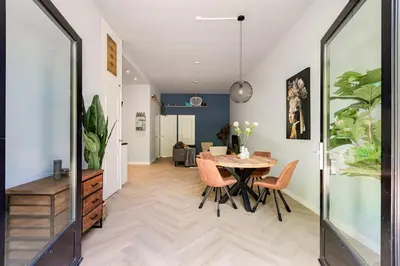 a dining room with a table and chairs at Stylish apartment next to the Amstel river- Unit D in Amsterdam