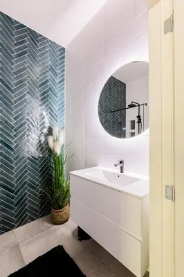 a bathroom with a white sink and a mirror at Stylish apartment next to the Amstel river- Unit D in Amsterdam