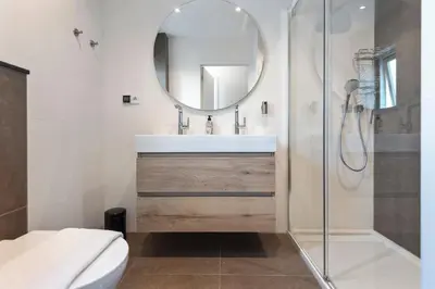 a bathroom with a sink and a mirror at Villa Harry with private parking in Zandvoort