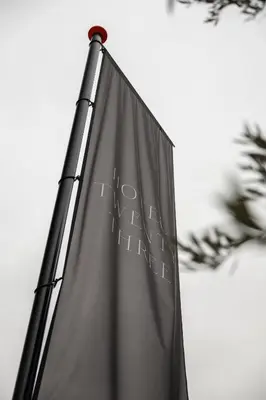 a black flag with writing on the side of it at Hotel Twenty-Three Amsterdam Airport in Hoofddorp