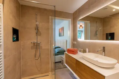 a bathroom with a sink and a shower at Beautifully located dune villa near Noordwijk beach in Noordwijk