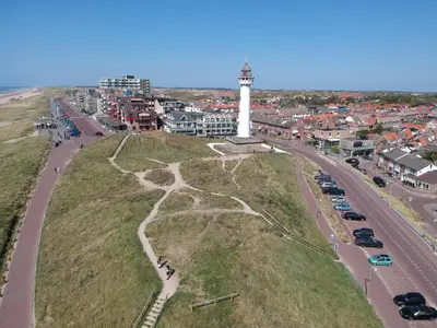 an aerial view of a lighthouse on a hill with a street at Zonnestralen in Egmond aan den Hoef