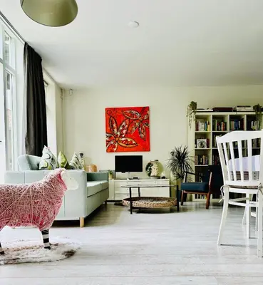 a living room with a pig statue in the middle of it at Perfectly located charming apartment MAGDALENA HOUSE for true connoisseurs in Haarlem
