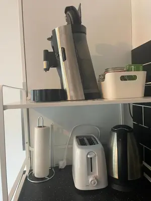 a kitchen shelf with various appliances on it at In Almere, Close to Amsterdam in Almere
