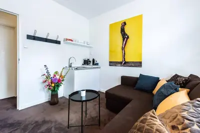 a living room with a couch and a table at Luxurious boutique suite in City Center in Amsterdam