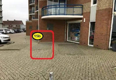 a sign that says in front of a building at Atlantis 15b in Egmond aan Zee