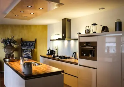 a kitchen with a wooden counter top in a room at Atlantis 15b in Egmond aan Zee