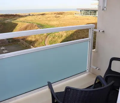a room with a window with a view of the ocean at Sea la Vie in Egmond aan Zee