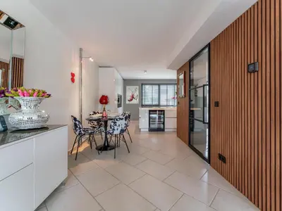 a kitchen and dining room with a table and chairs at Alkmaar aan het Water in Alkmaar