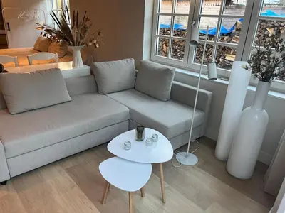 a living room with a couch and a table at Studio Elysium in Bergen