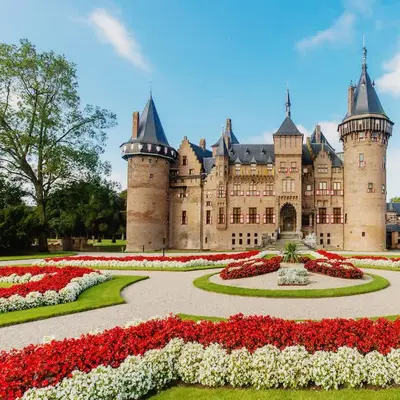 a castle with flowers in front of it at DomCity Apt Near Amsterdam Bikes Included One mile to City Centre in Utrecht