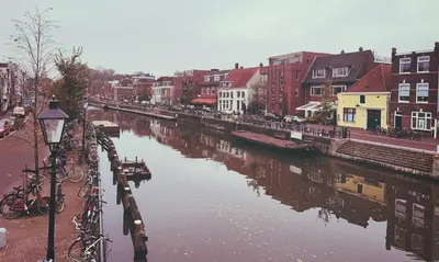 a river in a city with buildings next to a river at DomCity Apt Near Amsterdam Bikes Included One mile to City Centre in Utrecht